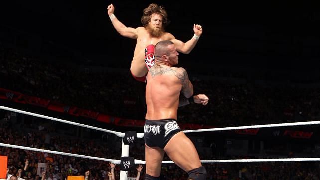 Bryan delivers a front missile drop kick to Randy Orton