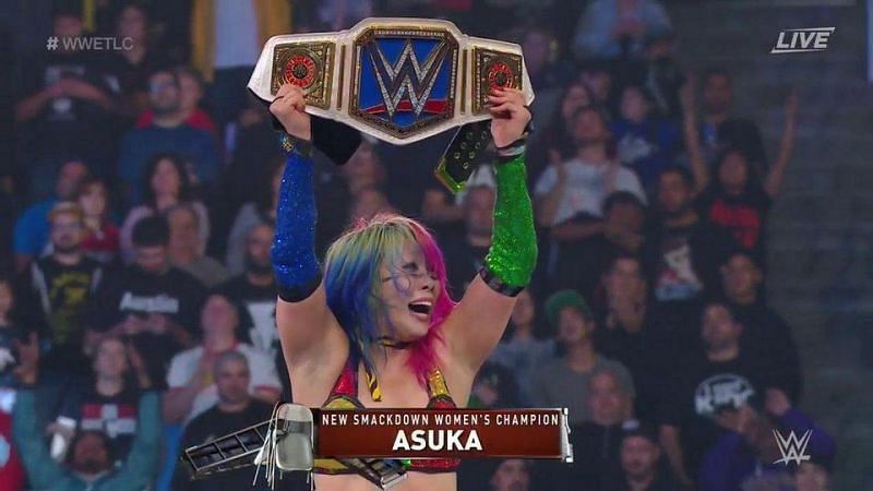 Asuka moments after winning the SmackDown Live Women&#039;s Championship at WWE TLC.