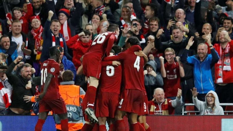 Liverpool&#039;s players celebrate after Salah&#039;s decisive goal