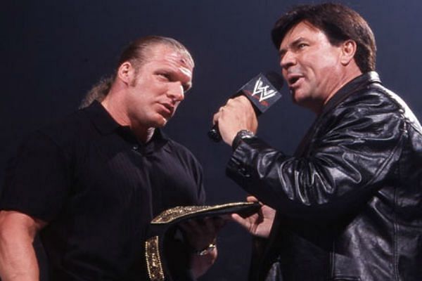 Bischoff awards Triple H the World Heavyweight Championship in 2002.