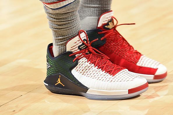 Jimmy Butler wearing these lit sneakers in his Sixers debut game against the Jazz