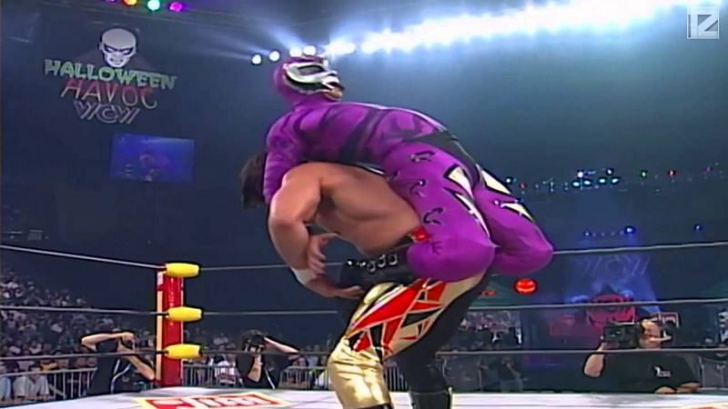 Eddie Guerrero sets up Rey Misterio for a Gory Bomb