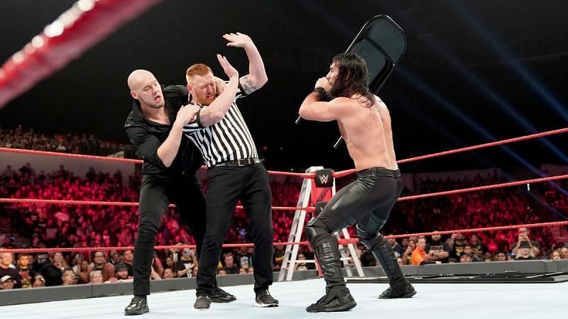 Corbin hides behind new referee Heath Slater during RAW&#039;s TLC Match.