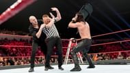 Corbin hides behind new referee Heath Slater during RAW's TLC Match.