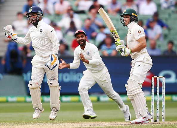 Rishabh Pant celebrates after taking the catch to dismiss Tim Paine