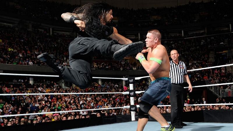 The Big Dog Roman Reigns unleashes a Superman Punch on the Doctor of Thuganomics John Cena
