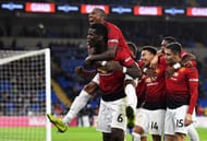 Pogba celebrating Jesse Lingard's goal with his team-mates in front of the traveling supporters