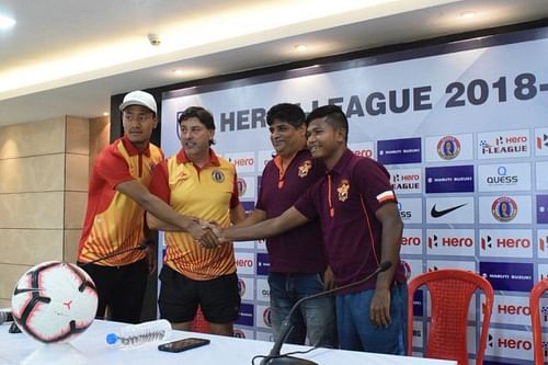 The two coach and players at the pre-match press conference