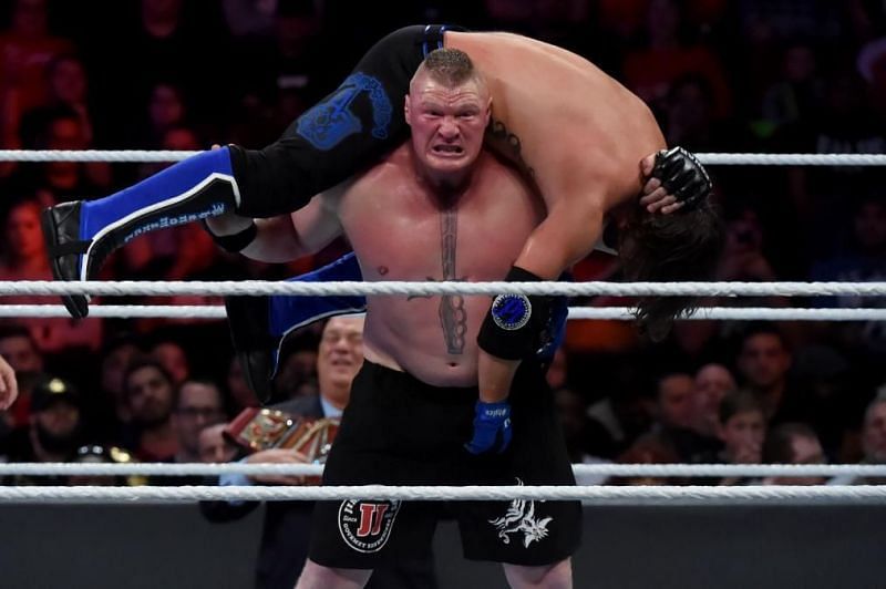 Brock Lesnar hefts the Phenomenal AJ Styles up for the F5