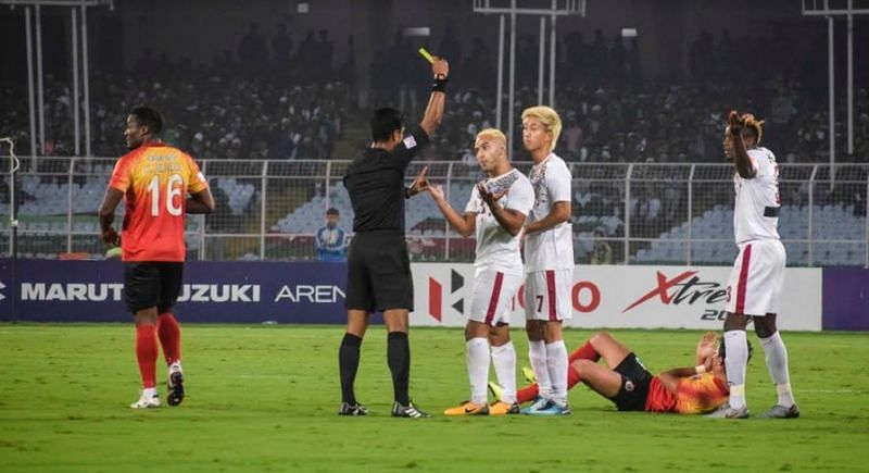 Kingsley being shown the yellow card