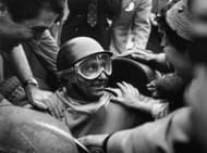 Fangio was a great team player and leader who inspired his team and helped in any way possible, even helping his mechanics with the car