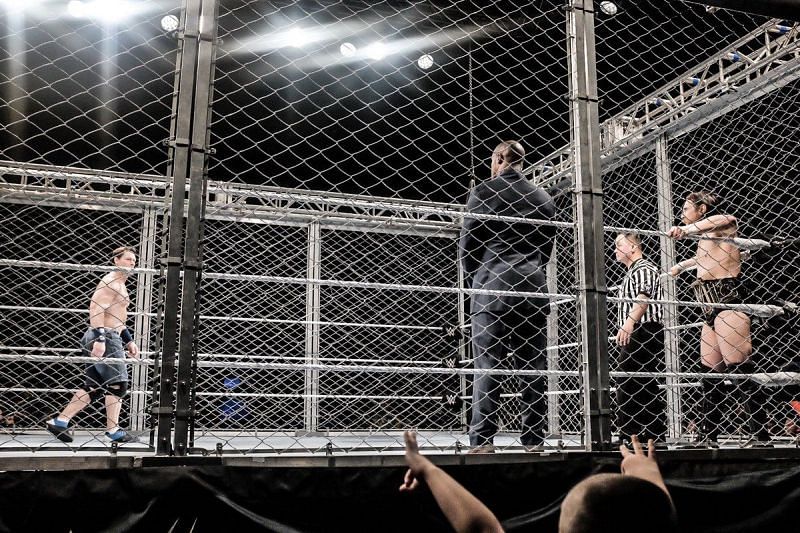 Cena vs Bryan inside a steel cage