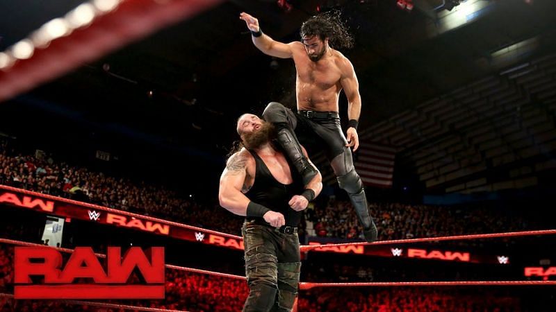 Seth Rollins leaps into the air to deliver a flying knee smash to Braun Strowman&#039;s head.