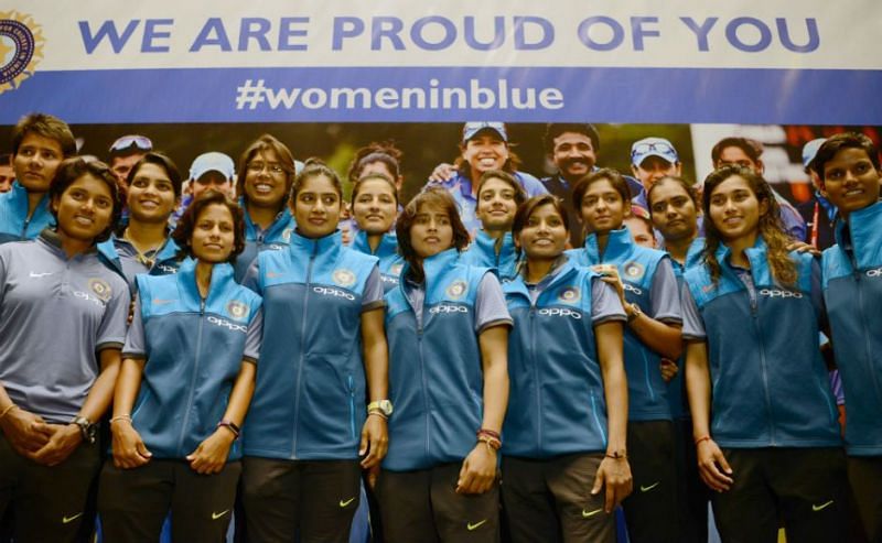 Women in Blue sporting a smile during an event