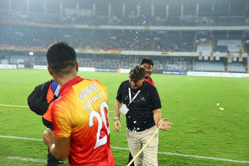 Menendez is champagne showered after the match