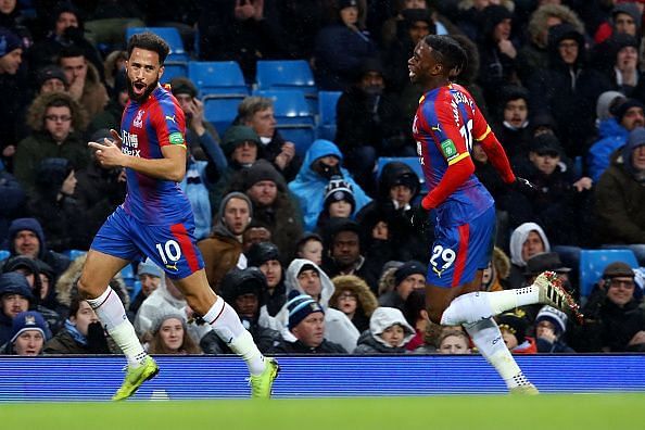 Andros Townsend wheels away to celebrate his excellent strike against Manchester City
