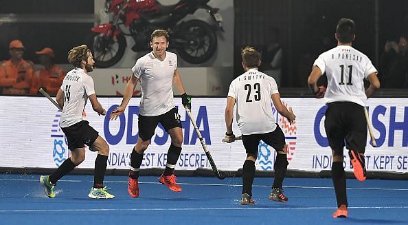 Canadian players celebrate after scoring their goal against Belgium