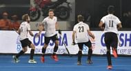 Canadian players celebrate after scoring their goal against Belgium