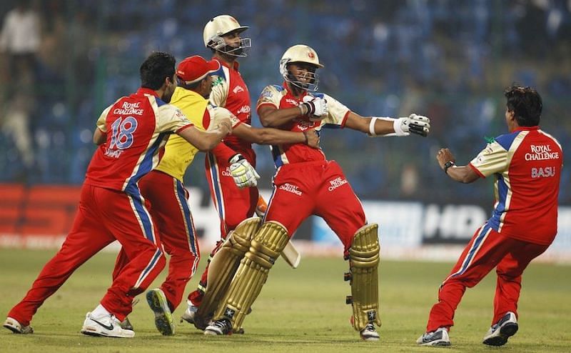 KB Arun Karthik (second from right) celebrates after his last-ball six