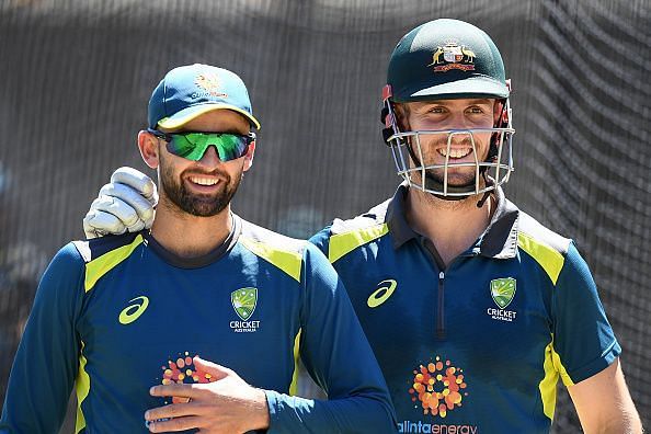 Nathan Lyon (l) during a training session