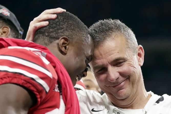 The Latest: Jags teammates salute Meyer, their former coach