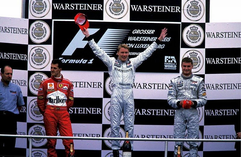 Hakkinen on the podium with Schumacher and Coulthard