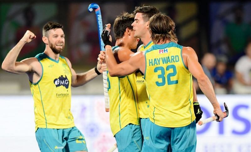 Australian players celebrate after scoring a goal against Ireland in their first match