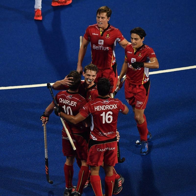 Cedric Charlier is congratulated by his teammates after scoring Belgium&#039;s third goal
