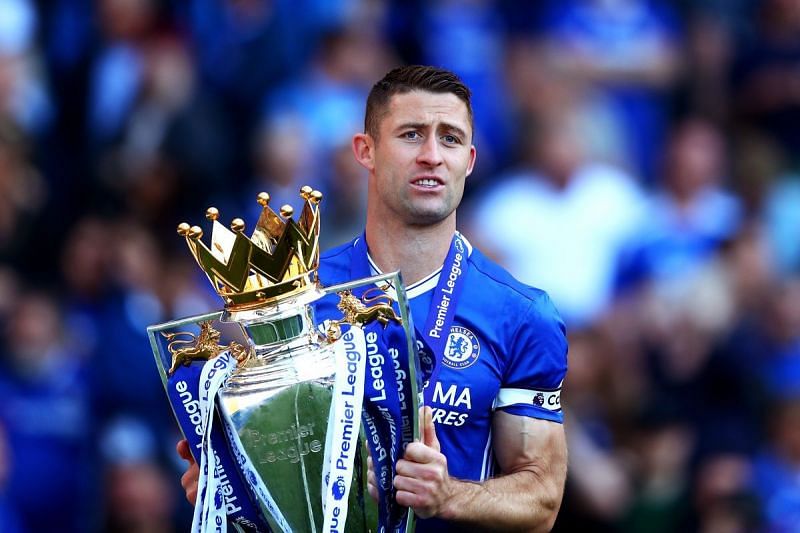 Gary Cahill holds the Premier League trophy