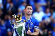Gary Cahill holds the Premier League trophy