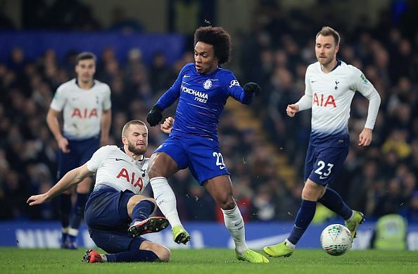 Eric Dier battles out to win the ball against Willian