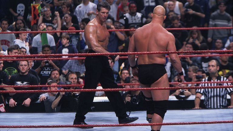 Mr. McMahon and Stone Cold circle as the 1999 Royal Rumble begins