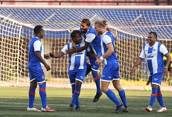 ITI's RC Prakash celebrates with Bengaluru FC stars Harmanjot Khabra and Erik Paartalu after scoring against HAL