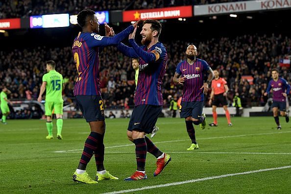 Messi celebrating with his teammates