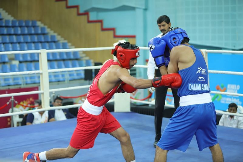 Ankit Narwal Narwal (Red) from Haryana in action during under-21 boys lightweight class (60kg) bout at Khelo India Youth Games