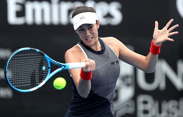 Garbine Muguruza dealt with the late night challenge to move on at the Sydney International early Tuesday morning