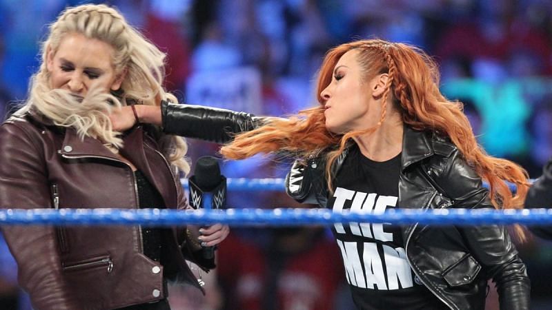 Suddenly, Becky strikes Charlotte in the face!
