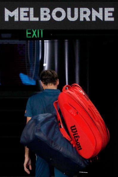 Federer leaves Rod Laver Arena after his four-set loss to Tsitsipas