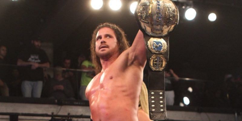 Johnny Impact (aka Mundo, Morrison, Nitro, et al.) holds the Impact world title