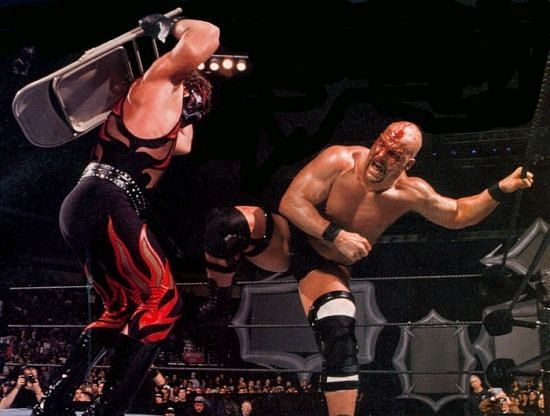 A bloodied Austin fighting with Kane during the 2001 Royal Rumble match