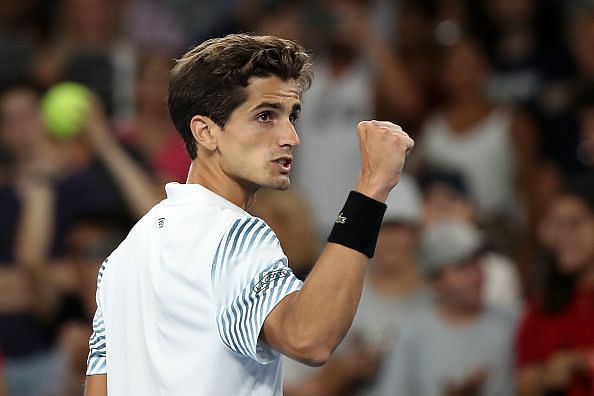 Pierre-Hugues Herbert pumps his fist in delight after getting past Hyeon Chung