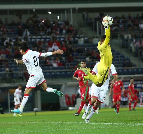 Faiz Al-Rushaidi of Oman with a leaping effort to catch the ball