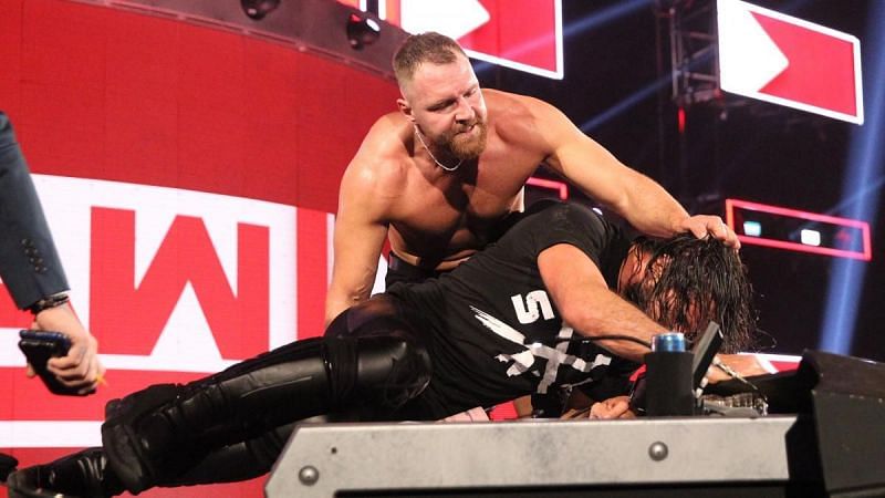 Ambrose punishes Rollins in their Falls Count Anywhere title match