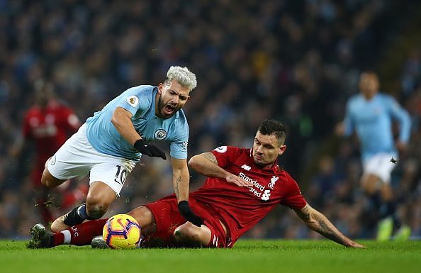 Lovren receives a yellow card for clattering into Aguero who is through on goal