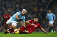 Lovren receives a yellow card for clattering into Aguero who is through on goal