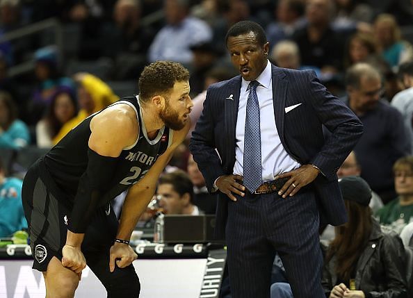 Blake Griffin speaking to head coach Dwane Casey during the Pistons&#039; game against the Hornets