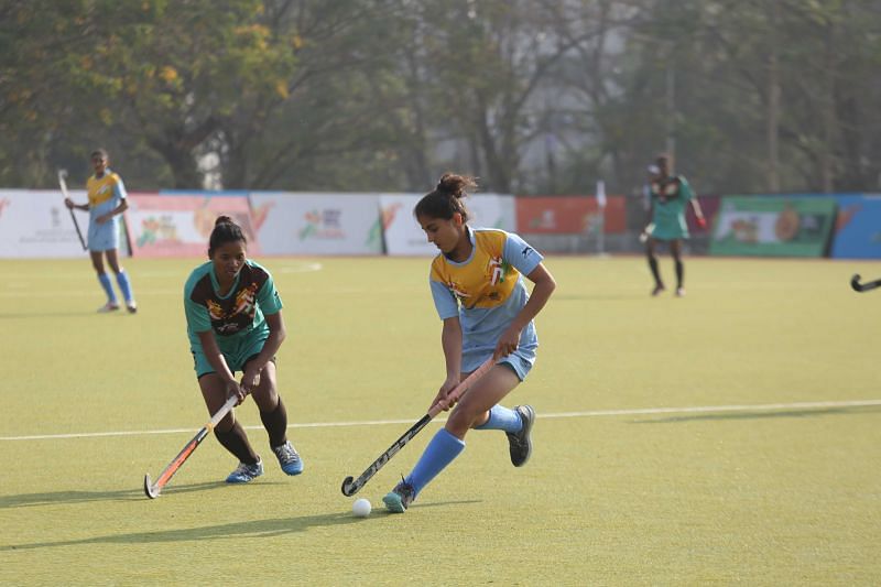 Haryana (in blue) in action against Jharkhand (in green) in the Girls U-21 Hockey Final at Khelo India Youth Games