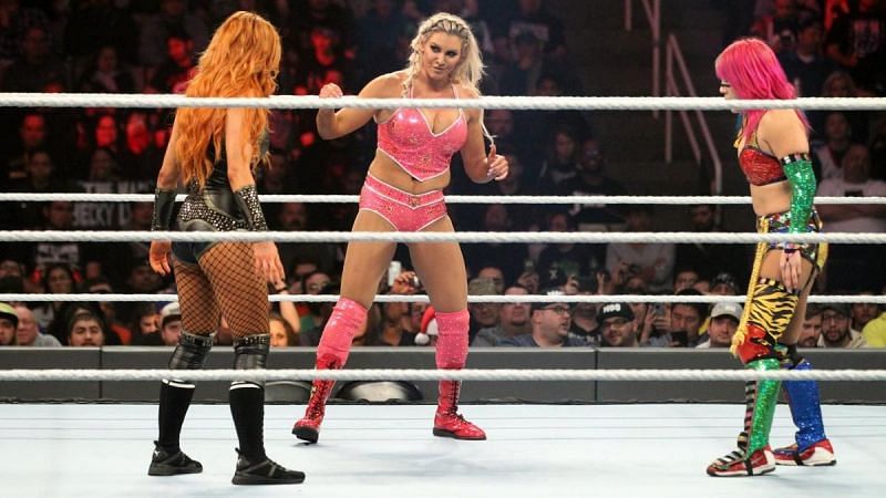 Asuka, Charlotte Flair and Becky Lynch during their match at TLC.
