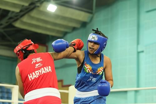 Haryanaâs Raj Sahiba (in blue) in action in girls U-17 boxing