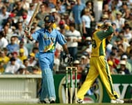 Badani raises his bat after scoring a half-century